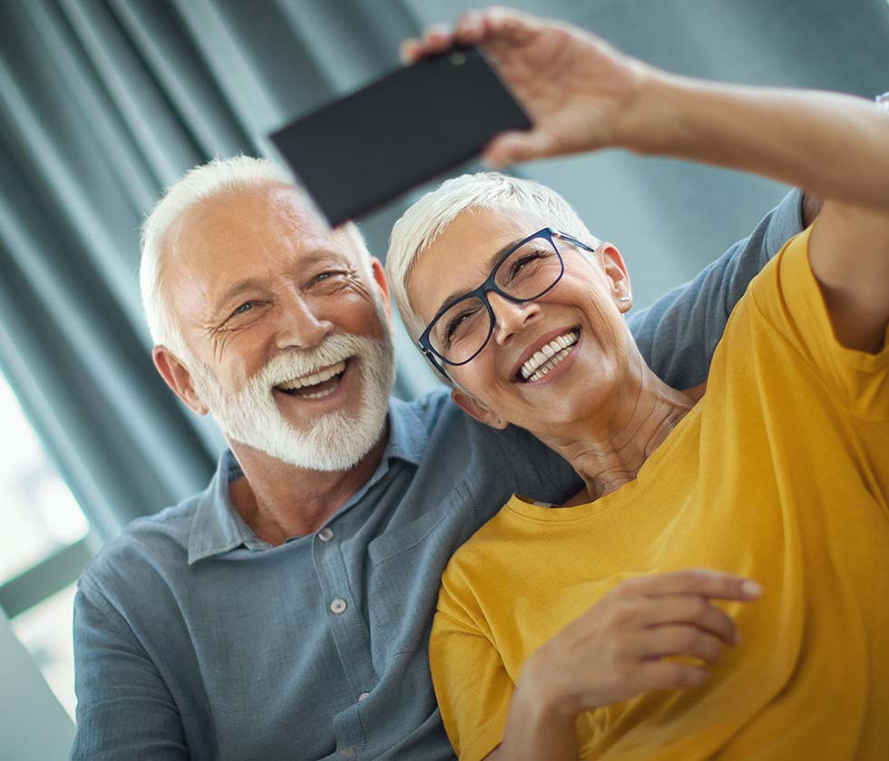 Couple smiling talking a selfie