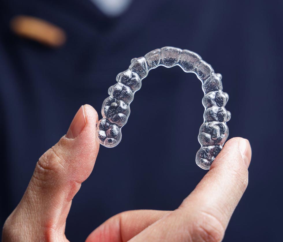 Holding clear aligner